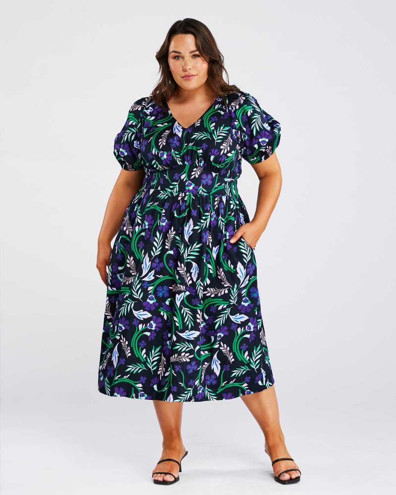 Front of a model wearing a size 18W Ultraviolet Floral Dress in Print by Estelle. | dia_product_style_image_id:302044